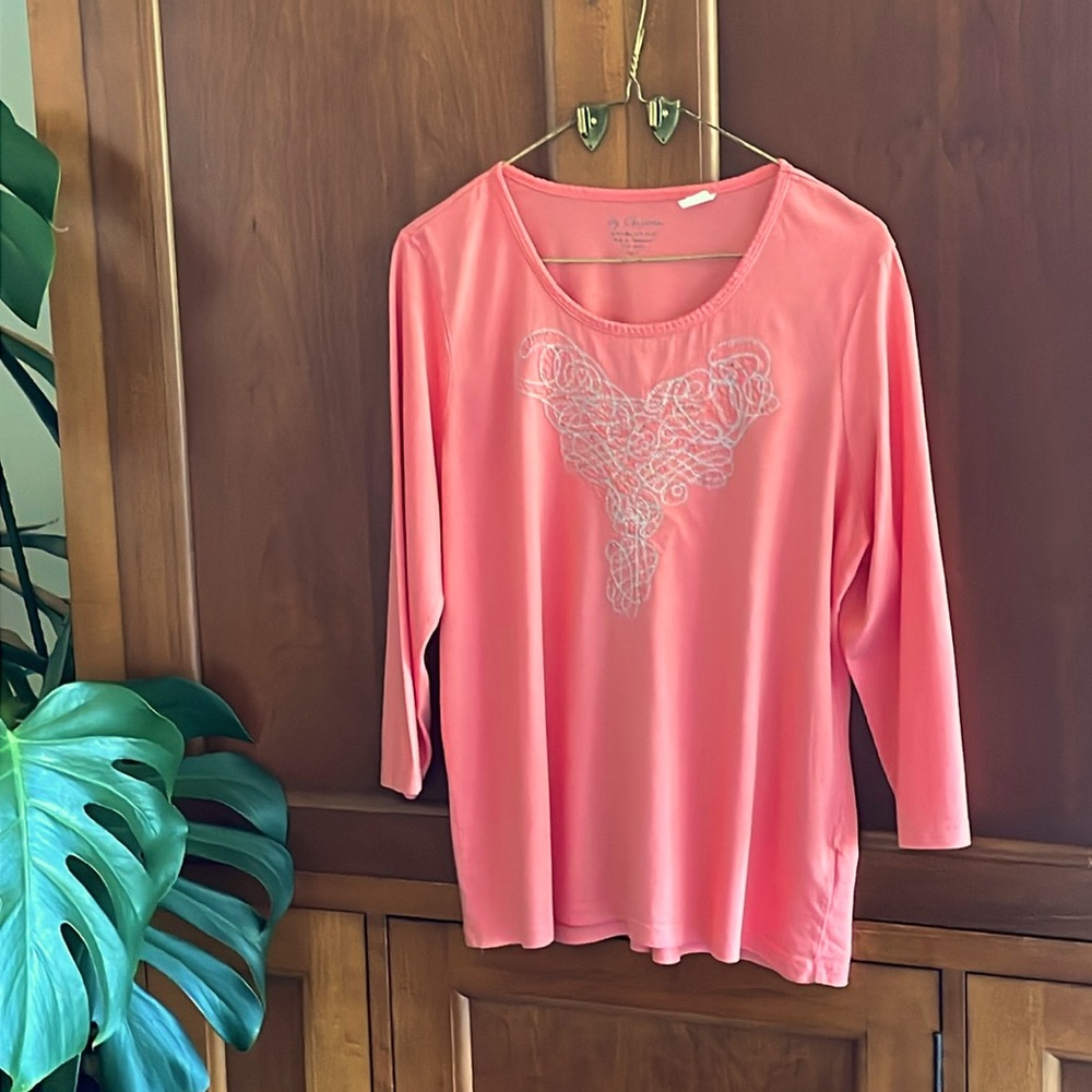 Soft orange Chico’s 3/4 length sleeve shirt with silver thread.